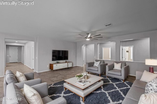 1020 E Wiley Squirrel Ln, Sahuarita, AZ 85629 - living area with baseboards, ceiling fan, and visible vents