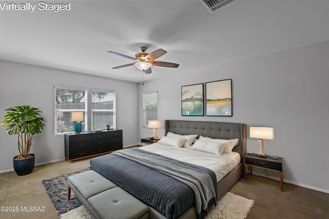 1020 E Wiley Squirrel Ln, Sahuarita, AZ 85629 - bedroom featuring baseboards, visible vents, light carpet, and ceiling fan