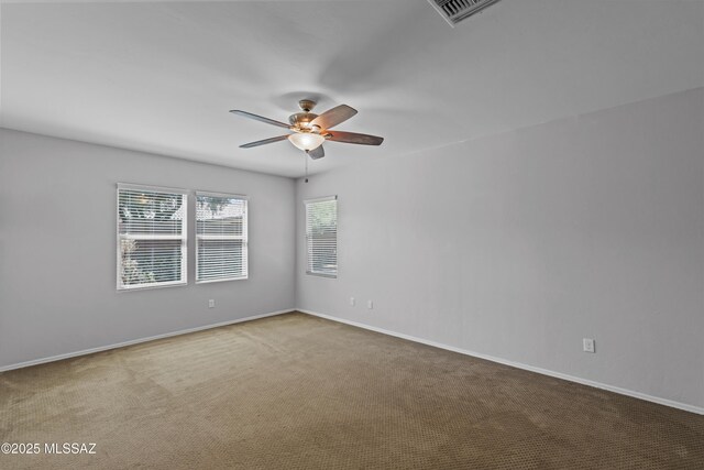 1020 E Wiley Squirrel Ln, Sahuarita, AZ 85629 - unfurnished room with carpet floors, ceiling fan, visible vents, and baseboards