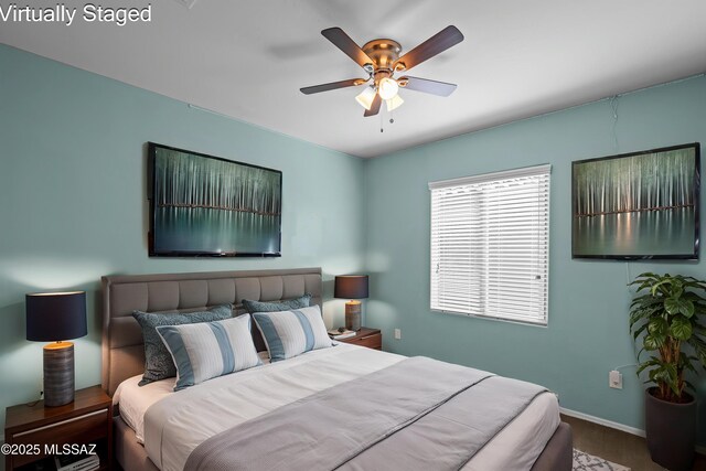 1020 E Wiley Squirrel Ln, Sahuarita, AZ 85629 - bedroom featuring a ceiling fan and baseboards