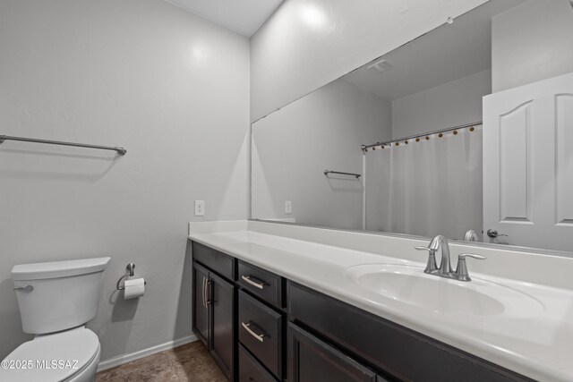 1020 E Wiley Squirrel Ln, Sahuarita, AZ 85629 - bathroom featuring toilet, baseboards, a shower with shower curtain, and vanity