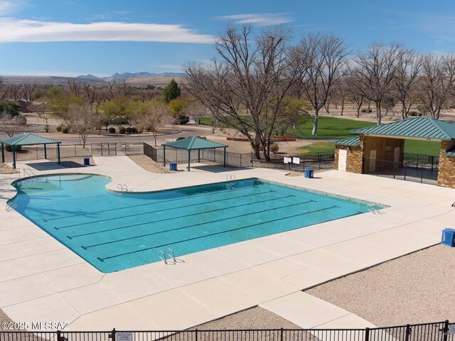1020 E Wiley Squirrel Ln, Sahuarita, AZ 85629 - pool featuring fence, a mountain view, a gazebo, and a patio area