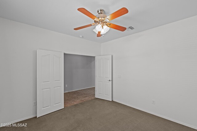1020 E Wiley Squirrel Ln, Sahuarita, AZ 85629 - unfurnished bedroom featuring carpet floors, baseboards, ceiling fan, and visible vents