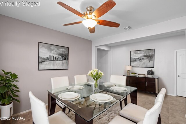 1020 E Wiley Squirrel Ln, Sahuarita, AZ 85629 - dining area with visible vents, a ceiling fan, baseboards, and light tile patterned floors