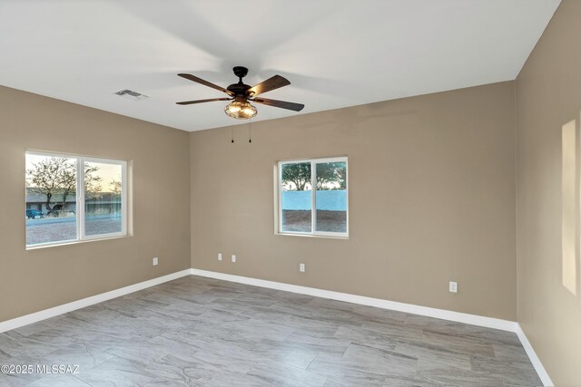1153 Escorpion Ct, Rio Rico, AZ 85648 - unfurnished bedroom featuring visible vents, baseboards, ceiling fan, and a closet