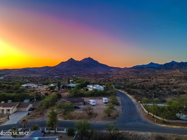 1153 Escorpion Ct, Rio Rico, AZ 85648 - unfurnished bedroom featuring baseboards, visible vents, ceiling fan, and ensuite bath