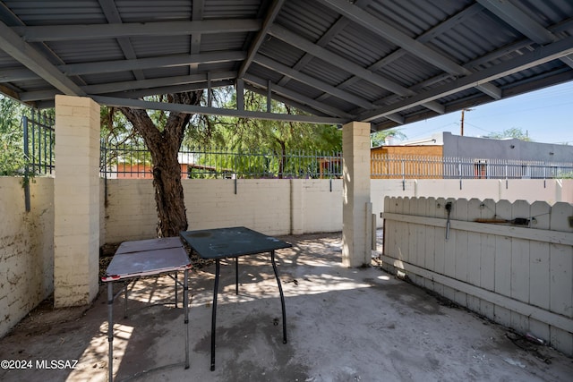 view of patio / terrace featuring fence
