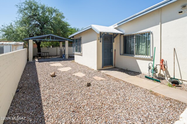 157 W Veterans Blvd, Tucson, AZ 85713 - view of property exterior with fence, a patio, stucco siding, and a gazebo
