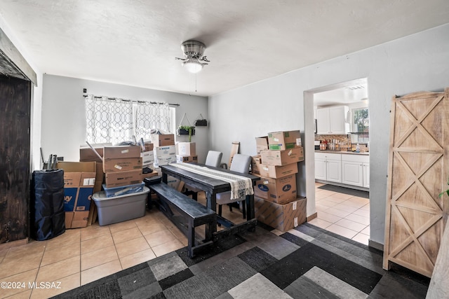 157 W Veterans Blvd, Tucson, AZ 85713 - tiled bedroom featuring ensuite bathroom and a ceiling fan