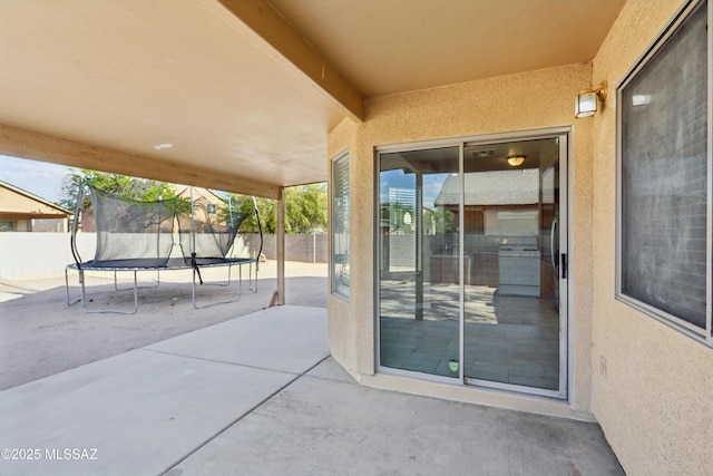 7351 S Bass Ave, Tucson, AZ 85746 - view of patio / terrace with a trampoline