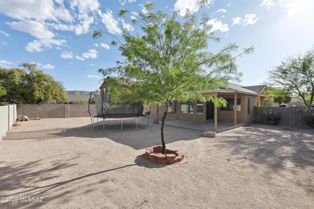 7351 S Bass Ave, Tucson, AZ 85746 - empty room with healthy amount of natural light, ceiling fan, and baseboards