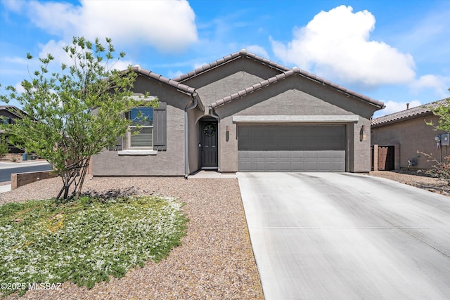 ranch-style house with a garage, stucco siding, driveway, and a tiled roof
