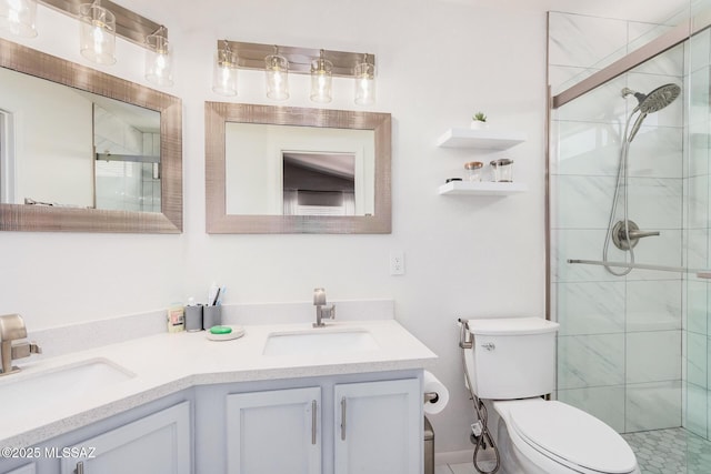 bathroom featuring a stall shower, toilet, and double vanity
