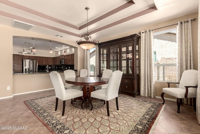 2436 E Desert Pueblo Pass, Green Valley, AZ 85614 - dining area featuring light tile patterned floors, a wealth of natural light, a tray ceiling, and visible vents