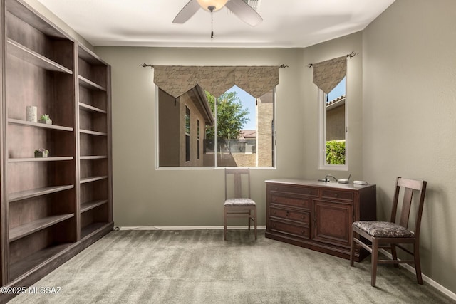 2436 E Desert Pueblo Pass, Green Valley, AZ 85614 - living area with baseboards, light colored carpet, and ceiling fan