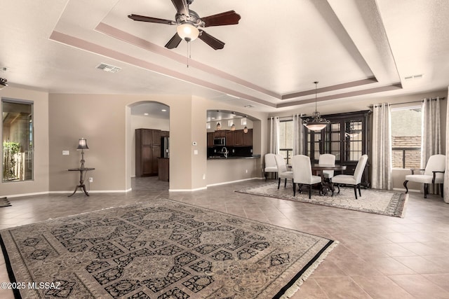 2436 E Desert Pueblo Pass, Green Valley, AZ 85614 - interior space featuring visible vents, arched walkways, a raised ceiling, and tile patterned floors