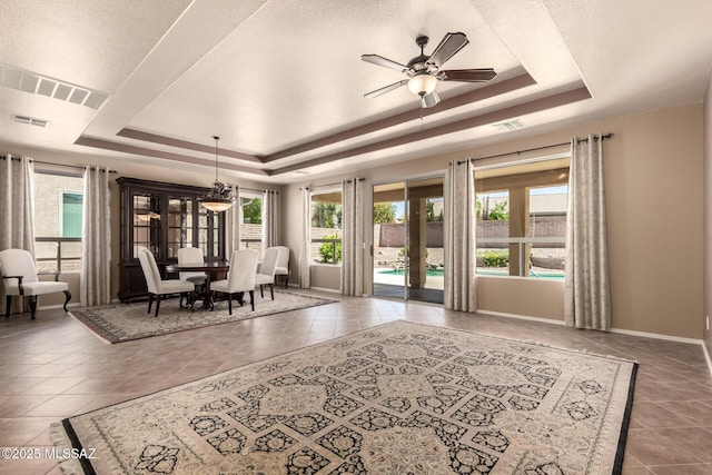 2436 E Desert Pueblo Pass, Green Valley, AZ 85614 - interior space featuring visible vents, a ceiling fan, tile patterned floors, and a tray ceiling
