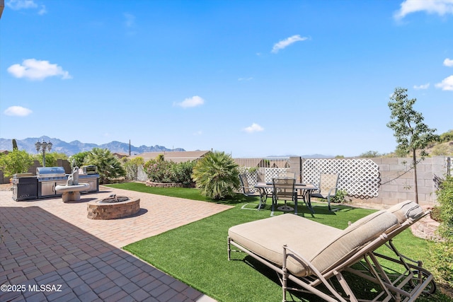 39930 S Mountain Shadow Dr, Tucson, AZ 85739 - view of patio / terrace with area for grilling, a fire pit, a mountain view, and outdoor dining space
