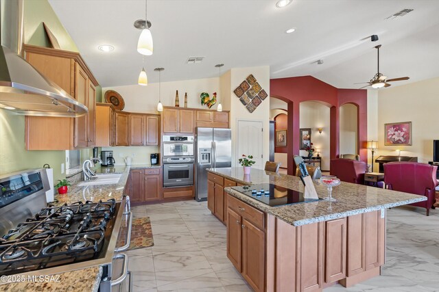 39930 S Mountain Shadow Dr, Tucson, AZ 85739 - kitchen with appliances with stainless steel finishes, vaulted ceiling, light marble finish floors, a sink, and arched walkways