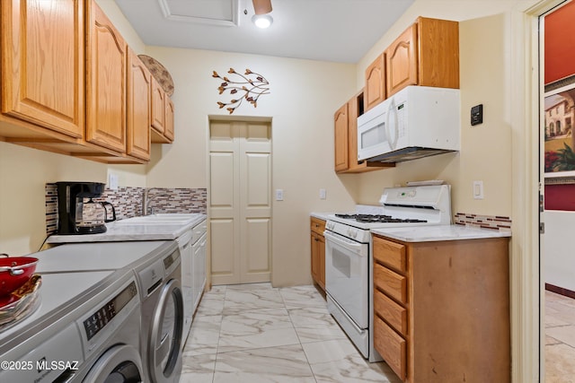 39930 S Mountain Shadow Dr, Tucson, AZ 85739 - kitchen featuring white appliances, separate washer and dryer, a sink, light marble finish flooring, and light countertops