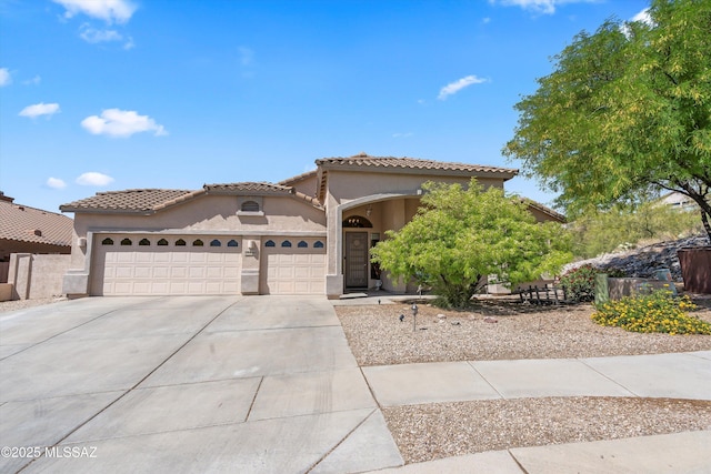 39930 S Mountain Shadow Dr, Tucson, AZ 85739 - mediterranean / spanish house featuring a garage, concrete driveway, stucco siding, and a tiled roof