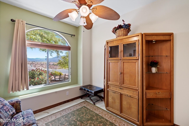 39930 S Mountain Shadow Dr, Tucson, AZ 85739 - living area featuring ceiling fan and baseboards