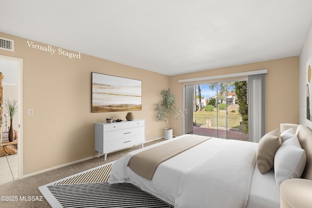carpeted bedroom featuring baseboards, visible vents, and access to exterior