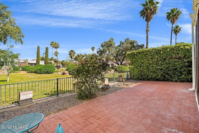 view of patio / terrace featuring fence