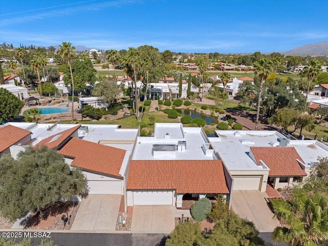 drone / aerial view featuring a mountain view and a residential view
