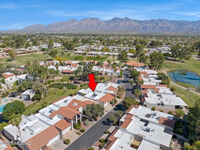 bird's eye view featuring a residential view, golf course view, and a water and mountain view