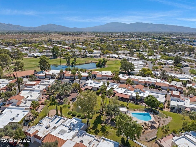 birds eye view of property with a residential view, a water and mountain view, and golf course view