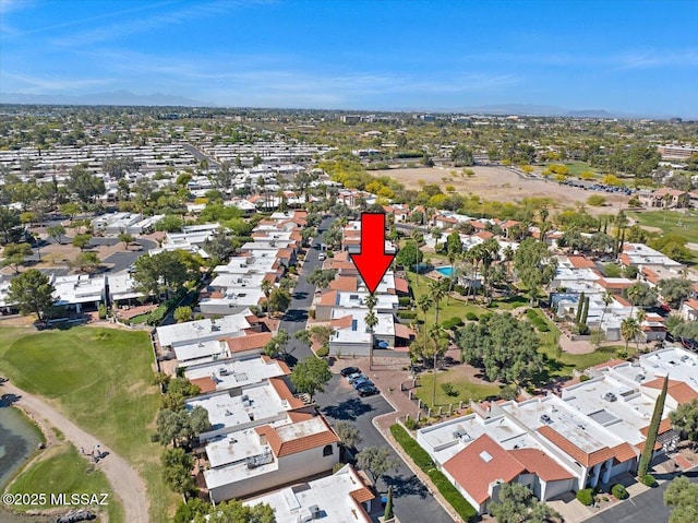 drone / aerial view with a residential view and golf course view