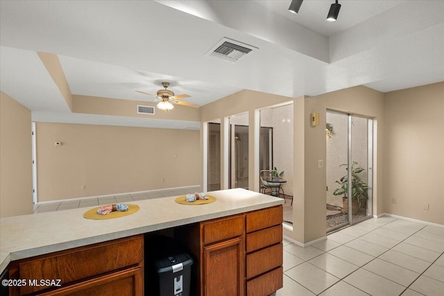 bathroom featuring visible vents, a ceiling fan, baseboards, and tile patterned flooring