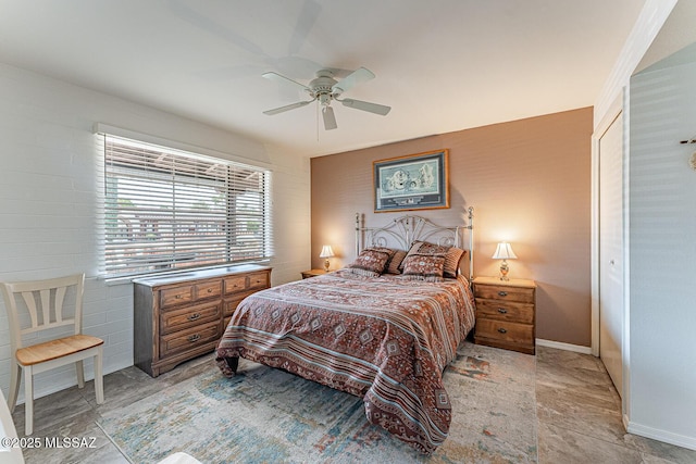 bedroom with baseboards and a ceiling fan