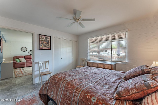 bedroom with ceiling fan and a closet