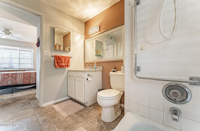 bathroom with vanity, a ceiling fan, and toilet