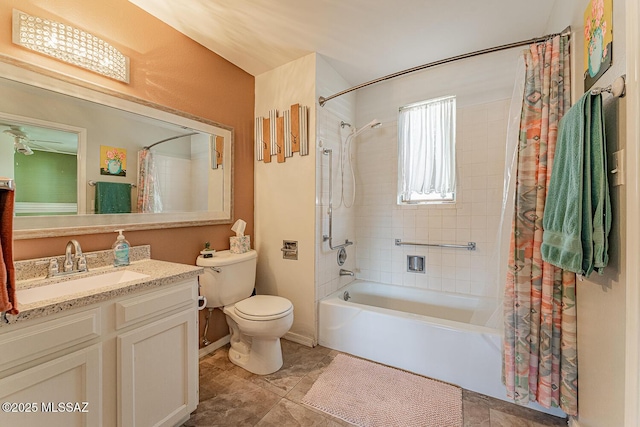 bathroom with tile patterned flooring, vanity, toilet, baseboards, and shower / tub combo