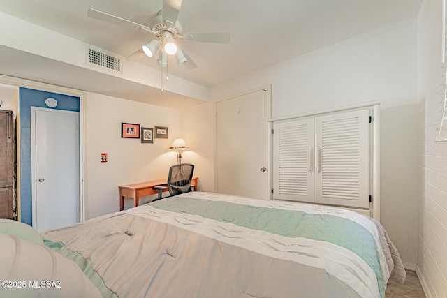 bedroom featuring ceiling fan, a closet, and visible vents
