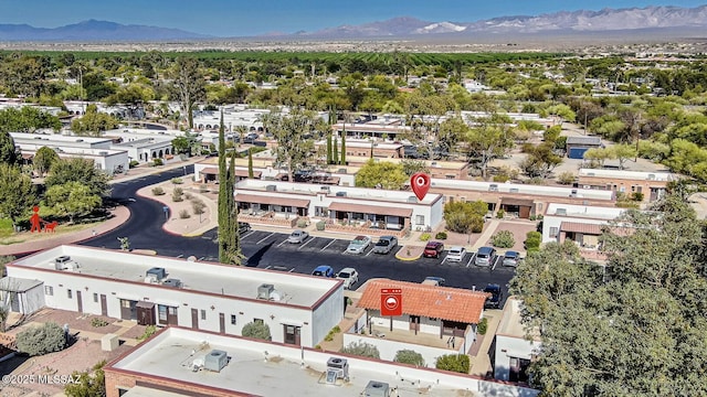 birds eye view of property featuring a mountain view