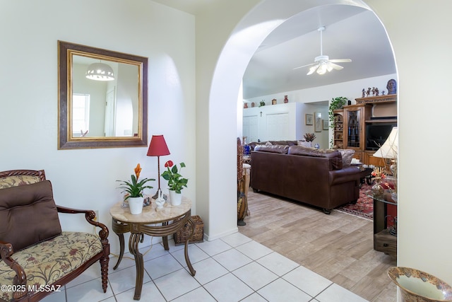 21 Kachina, Rio Rico, AZ 85648 - living room featuring arched walkways, ceiling fan, and light tile patterned flooring