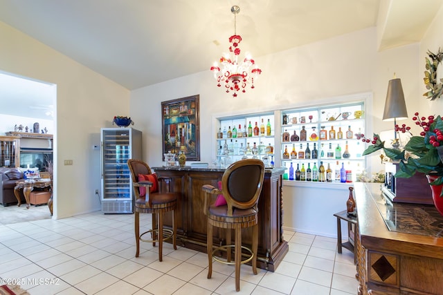 21 Kachina, Rio Rico, AZ 85648 - bar featuring beverage cooler, a chandelier, bar area, and light tile patterned flooring