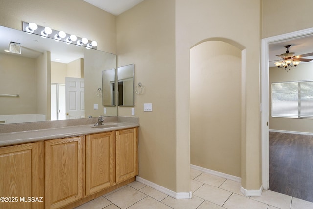 full bathroom featuring baseboards, ceiling fan, tile patterned floors, and vanity