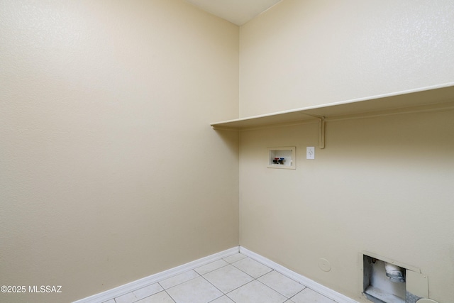laundry room with light tile patterned flooring, laundry area, washer hookup, gas dryer hookup, and baseboards