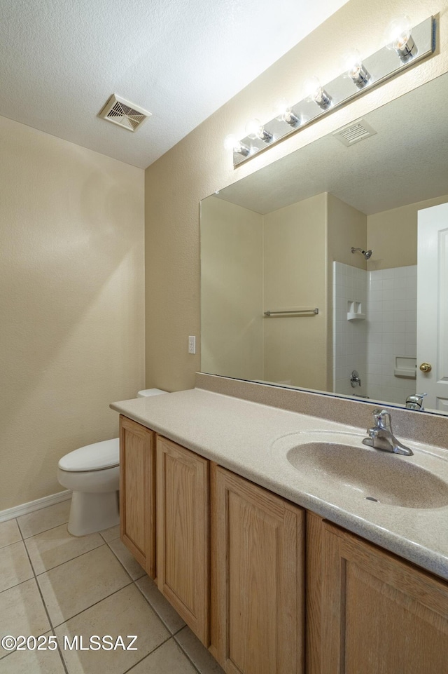 full bathroom featuring vanity, toilet, tile patterned floors, a shower, and visible vents