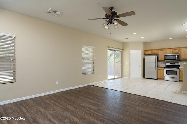 kitchen featuring visible vents, ceiling fan, light wood-type flooring, recessed lighting, and stainless steel appliances