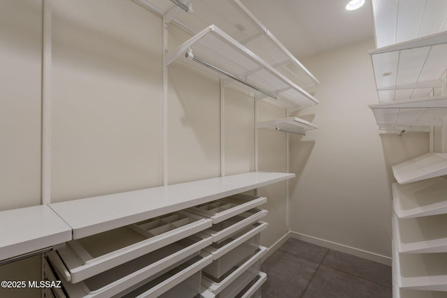 walk in closet featuring tile patterned floors