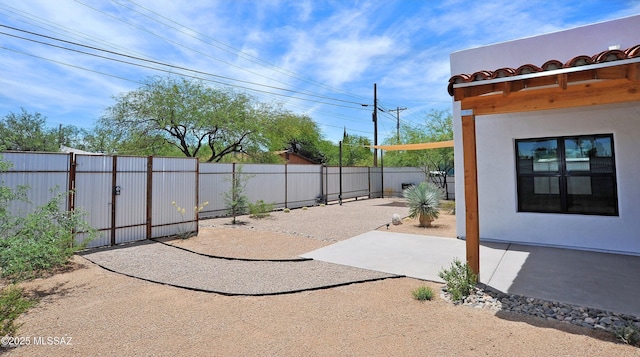 view of patio / terrace with a fenced backyard and a gate