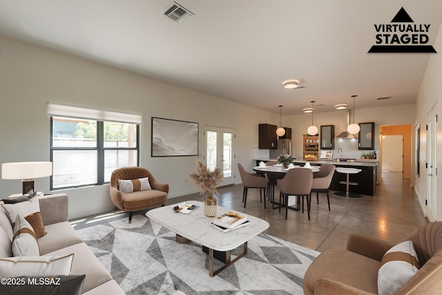 living area featuring visible vents