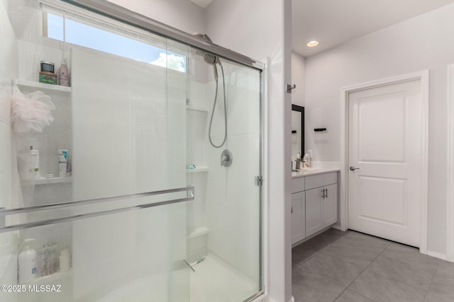 7688 S Via Perfecta, Tucson, AZ 85756 - bathroom with a shower stall, plenty of natural light, vanity, tile patterned floors, and recessed lighting