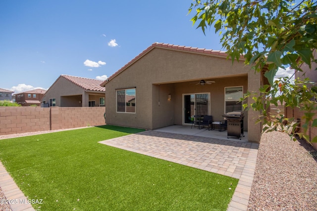 7688 S Via Perfecta, Tucson, AZ 85756 - rear view of house with ceiling fan, stucco siding, a patio, and a tile roof